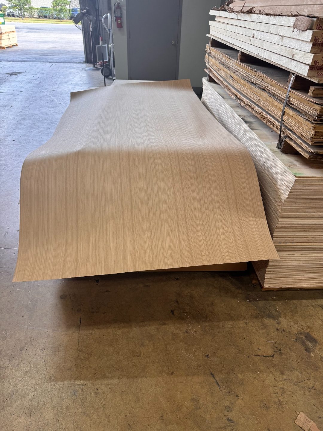 Large veneer panel on floor at International Plywood Miami warehouse
